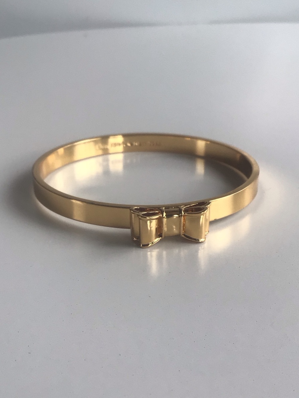 Kate Spade New York gold bow bangle bracelet